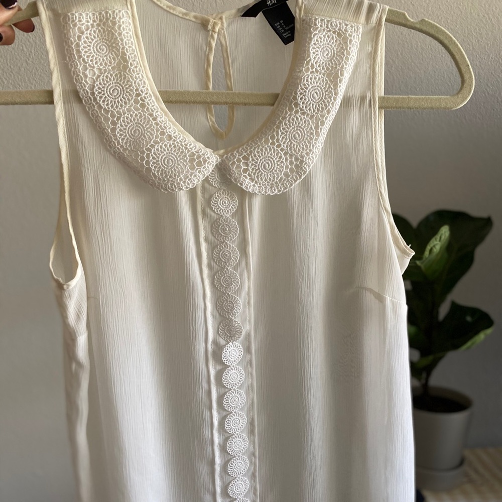 White sleeveless top